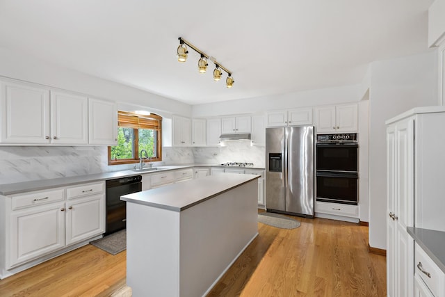 172 Hamilton Ave, Frankfort, IL 60423 - kitchen featuring black appliances, a sink, backsplash, and white cabinetry