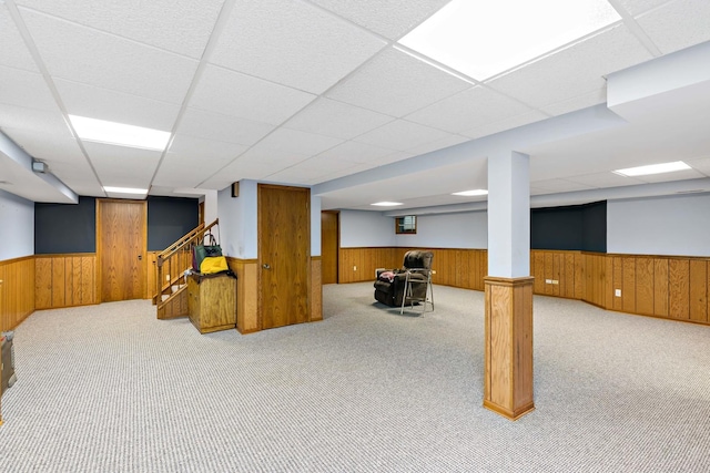 172 Hamilton Ave, Frankfort, IL 60423 - finished below grade area with a wainscoted wall, a paneled ceiling, carpet flooring, wooden walls, and stairs