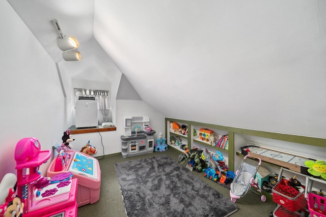 rec room featuring lofted ceiling and carpet floors