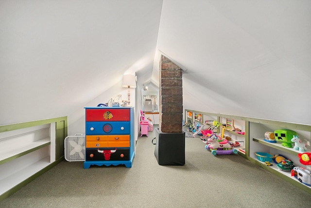 playroom with carpet floors and vaulted ceiling