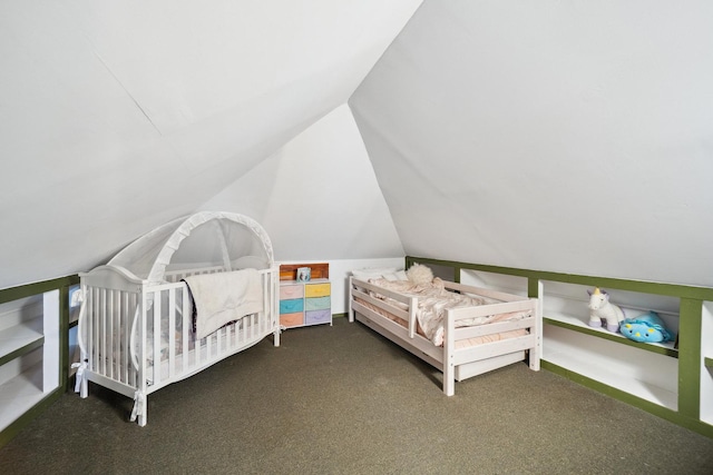 bedroom featuring carpet, lofted ceiling, and a nursery area