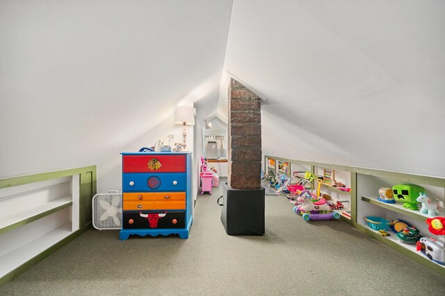 game room with carpet floors and vaulted ceiling