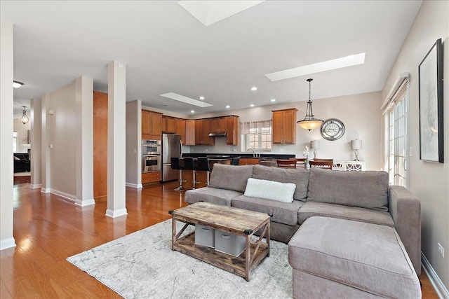 13093 Timber Ct Unit 61, Palos Heights, IL 60463 - living room with a skylight, wood finished floors, and recessed lighting