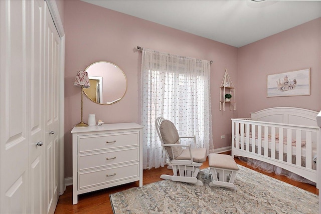 13093 Timber Ct Unit 61, Palos Heights, IL 60463 - bedroom with a nursery area and dark wood-style flooring