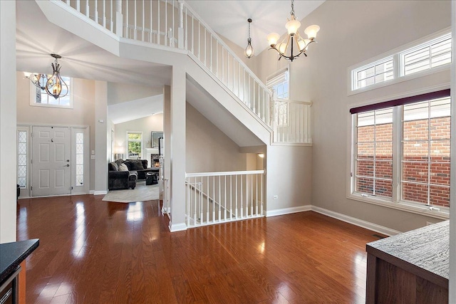 13093 Timber Ct Unit 61, Palos Heights, IL 60463 - foyer entrance with a chandelier, high vaulted ceiling, and wood finished floors