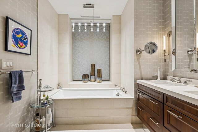 118 E Erie St Unit 21D, Chicago, IL 60611 - full bath with a garden tub, double vanity, tile walls, and tile patterned floors