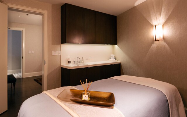118 E Erie St Unit 21D, Chicago, IL 60611 - bedroom featuring wet bar, tile patterned flooring, and baseboards