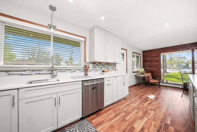 1423 N River Rd, Mchenry, IL 60050 - kitchen with stainless steel dishwasher, a sink, light wood-style floors, light countertops, and recessed lighting