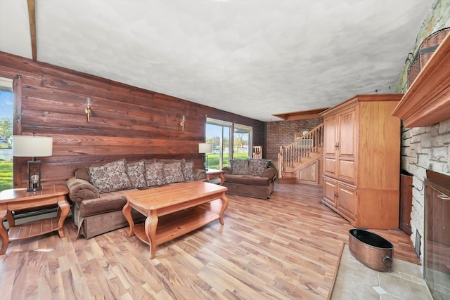 1423 N River Rd, Mchenry, IL 60050 - living room with stairway, light wood-type flooring, and a baseboard radiator