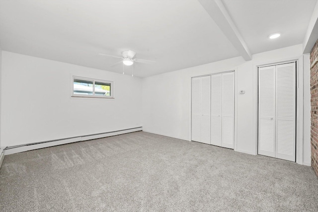 1423 N River Rd, Mchenry, IL 60050 - unfurnished bedroom featuring a baseboard radiator, carpet, beam ceiling, multiple closets, and a ceiling fan