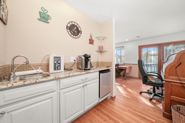 1423 N River Rd, Mchenry, IL 60050 - bar featuring a sink, light wood-type flooring, and tasteful backsplash