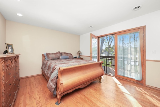 1423 N River Rd, Mchenry, IL 60050 - bedroom with access to exterior, light wood finished floors, baseboards, and recessed lighting