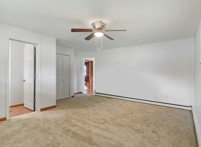 1423 N River Rd, Mchenry, IL 60050 - unfurnished bedroom with carpet, baseboard heating, baseboards, a closet, and ceiling fan