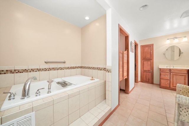 1423 N River Rd, Mchenry, IL 60050 - bathroom with tile patterned floors, a garden tub, and vanity