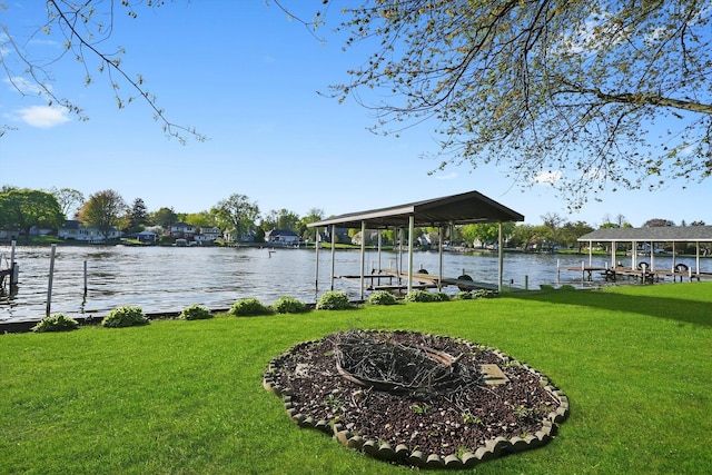 1423 N River Rd, Mchenry, IL 60050 - dock with boat lift, a lawn, and a water view