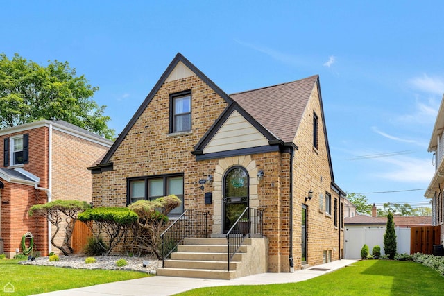 10407 S Artesian Ave, Chicago, IL 60655 - tudor-style house with brick siding and a shingled roof