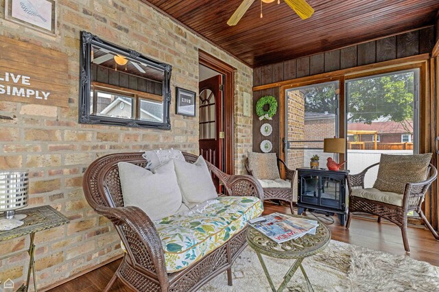 10407 S Artesian Ave, Chicago, IL 60655 - living area with plenty of natural light, a ceiling fan, wood finished floors, brick wall, and wood ceiling