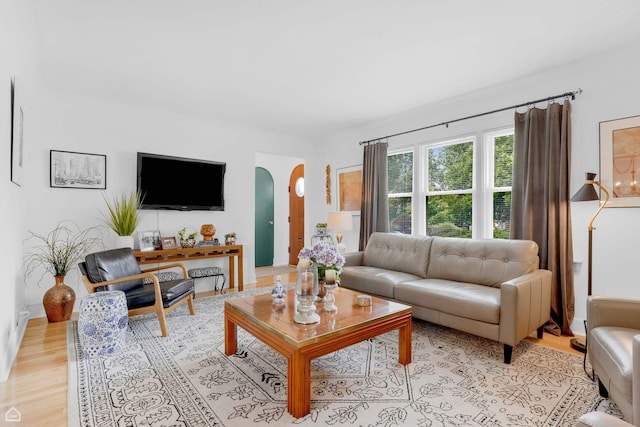10407 S Artesian Ave, Chicago, IL 60655 - living area with arched walkways and light wood-style flooring