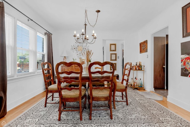 10407 S Artesian Ave, Chicago, IL 60655 - dining area featuring a chandelier, light wood finished floors, and baseboards