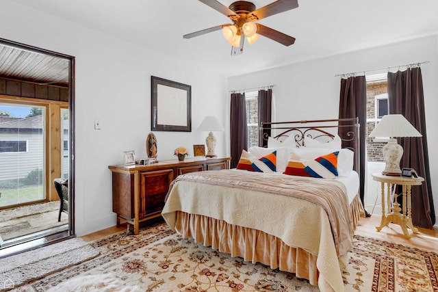 10407 S Artesian Ave, Chicago, IL 60655 - bedroom featuring multiple windows, light wood finished floors, access to outside, and ceiling fan