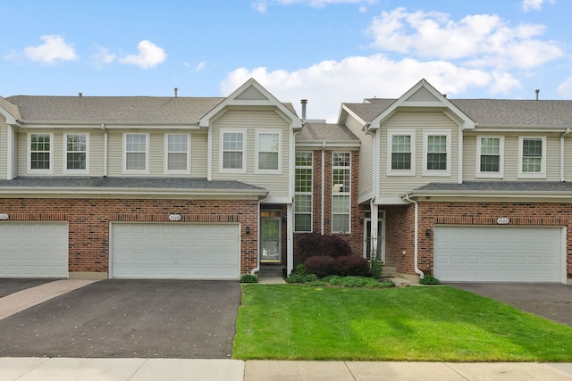 7324 Chestnut Hills Dr, Burr Ridge, IL 60527 - townhome / multi-family property with an attached garage, driveway, a front yard, and brick siding