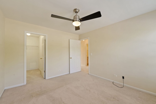 7324 Chestnut Hills Dr, Burr Ridge, IL 60527 - unfurnished bedroom with light colored carpet, baseboards, a walk in closet, ceiling fan, and a closet