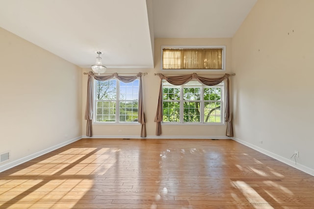 7324 Chestnut Hills Dr, Burr Ridge, IL 60527 - unfurnished dining area with a chandelier, baseboards, hardwood / wood-style floors, and vaulted ceiling