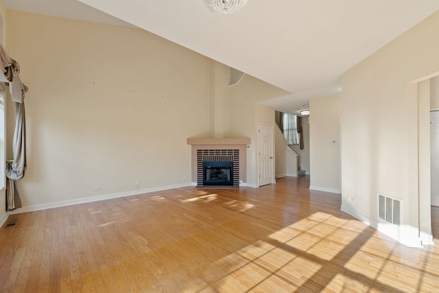 7324 Chestnut Hills Dr, Burr Ridge, IL 60527 - unfurnished living room featuring light wood finished floors, baseboards, and a fireplace