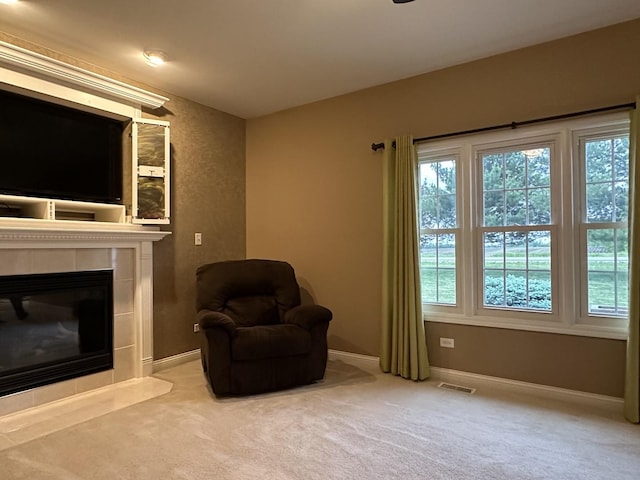 445 Spring Park Loop, Bourbonnais, IL 60914 - sitting room featuring carpet flooring, baseboards, and a tiled fireplace