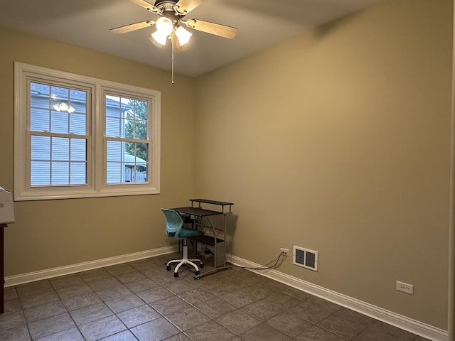 445 Spring Park Loop, Bourbonnais, IL 60914 - empty room featuring baseboards, ceiling fan, and dark tile patterned flooring