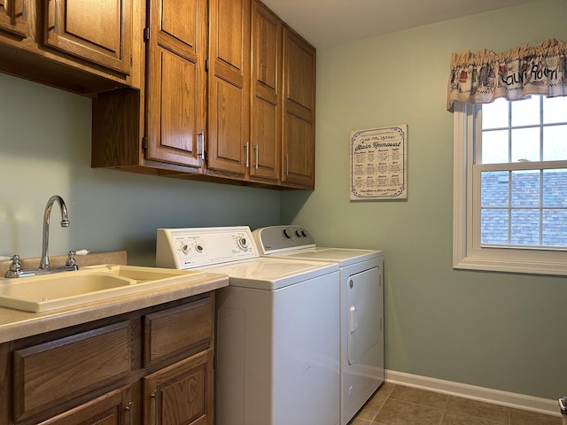 445 Spring Park Loop, Bourbonnais, IL 60914 - laundry area featuring cabinet space, washing machine and clothes dryer, tile patterned flooring, and baseboards