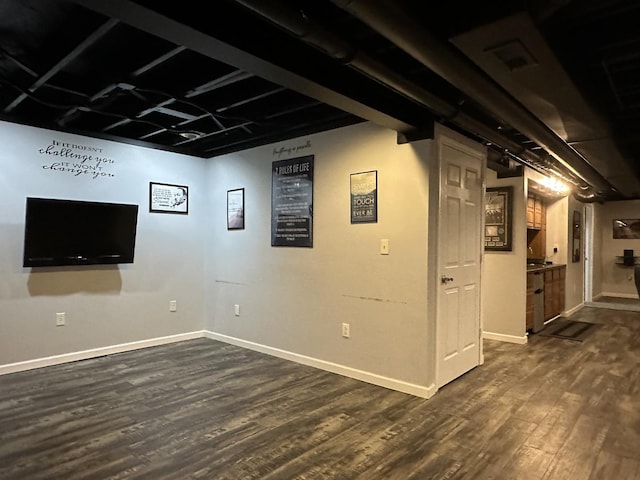 445 Spring Park Loop, Bourbonnais, IL 60914 - finished basement featuring dark wood-style floors and baseboards