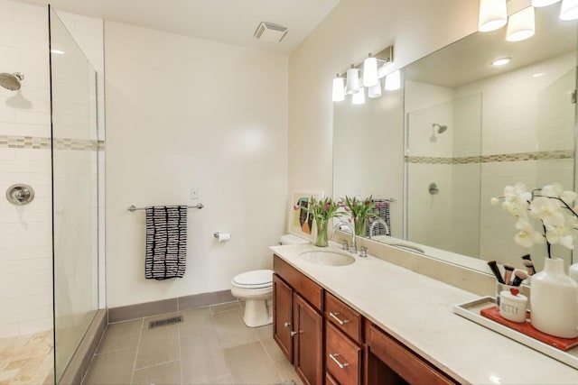 335 E Cullerton St, Chicago, IL 60616 - full bath with a tile shower, toilet, double vanity, tile patterned floors, and baseboards