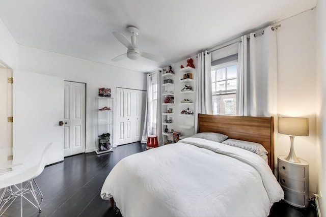 335 E Cullerton St, Chicago, IL 60616 - bedroom featuring two closets, dark wood-type flooring, and a ceiling fan