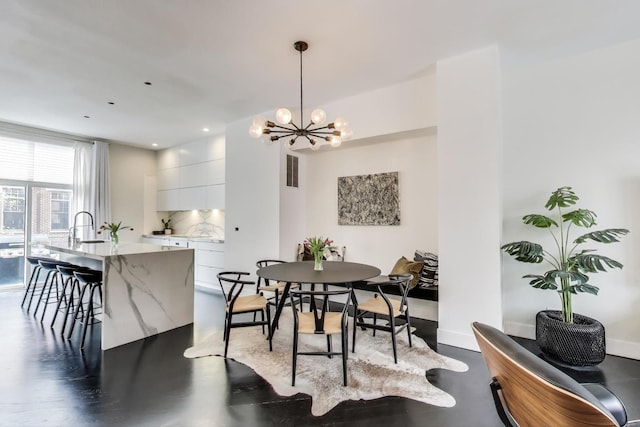 335 E Cullerton St, Chicago, IL 60616 - dining space featuring a chandelier and baseboards