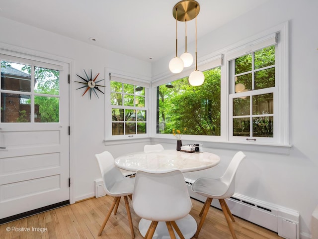 411 Linden Ave, Oak Park, IL 60302 - dining area with light wood-type flooring and baseboard heating