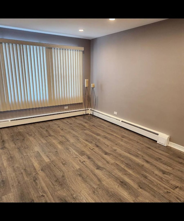 720 N Western Ave Unit 10, Park Ridge, IL 60068 - spare room featuring wood finished floors, baseboards, baseboard heating, and recessed lighting