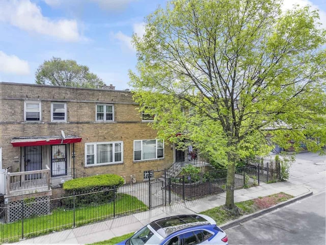 7843 S Yates Blvd, Chicago, IL 60649 - multi unit property with a fenced front yard and brick siding