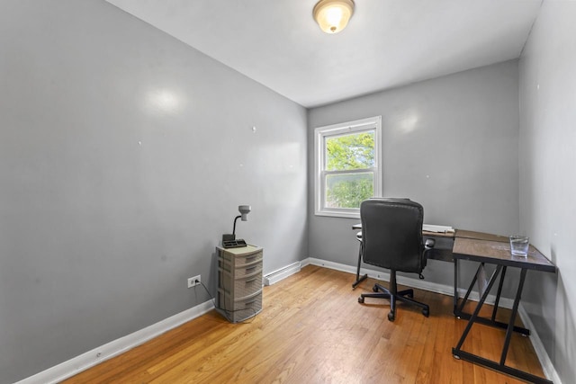 7843 S Yates Blvd, Chicago, IL 60649 - office featuring light wood finished floors, baseboards, and baseboard heating