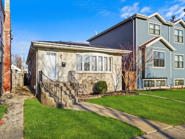 3405 N Osage Ave, Chicago, IL 60634 - view of front facade with roof mounted solar panels and stone siding