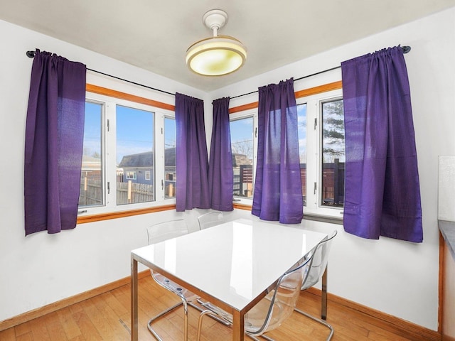 3405 N Osage Ave, Chicago, IL 60634 - dining room featuring baseboards and wood finished floors