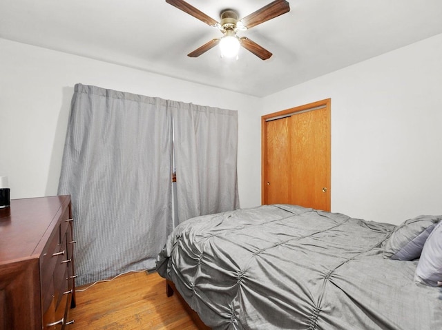 3405 N Osage Ave, Chicago, IL 60634 - bedroom featuring light wood-style flooring, a closet, and ceiling fan