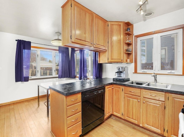 3405 N Osage Ave, Chicago, IL 60634 - kitchen with black dishwasher, a sink, dark countertops, and a peninsula