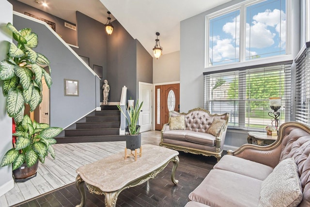 1 Churchill Ct, South Elgin, IL 60177 - living area featuring stairs, high vaulted ceiling, wood finished floors, and baseboards