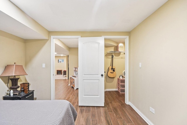 1 Churchill Ct, South Elgin, IL 60177 - bedroom with dark wood finished floors, a walk in closet, baseboards, and a closet