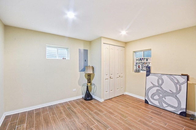 1 Churchill Ct, South Elgin, IL 60177 - unfurnished bedroom with baseboards, wood finished floors, electric panel, and a closet
