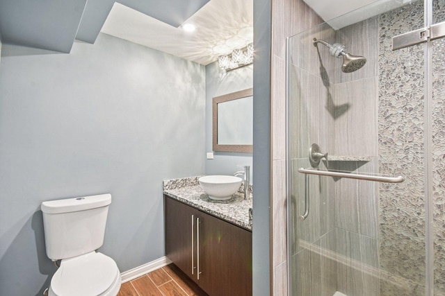 1 Churchill Ct, South Elgin, IL 60177 - full bath featuring vanity, a tile shower, wood finished floors, and toilet