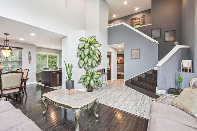 1 Churchill Ct, South Elgin, IL 60177 - living area with wood finished floors, stairway, a towering ceiling, baseboards, and recessed lighting