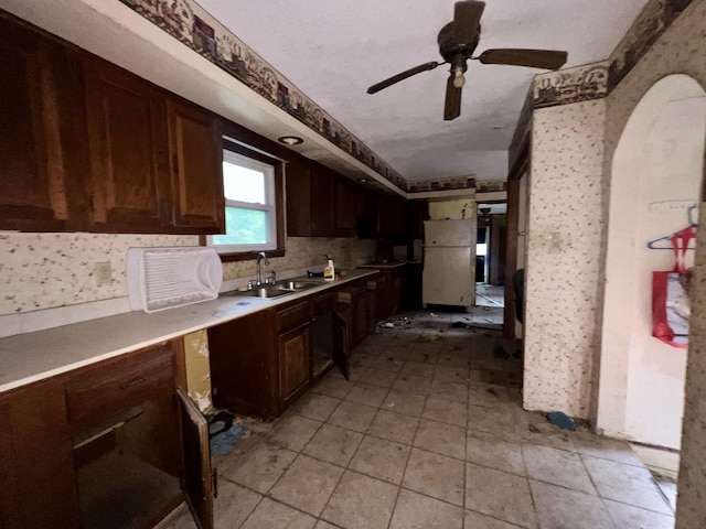 103 W 2nd St, Broadlands, IL 61816 - kitchen with a sink, a ceiling fan, light countertops, and dark brown cabinets