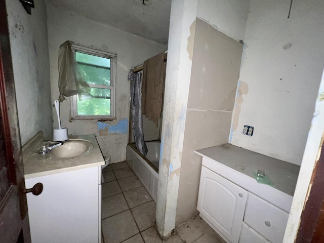 103 W 2nd St, Broadlands, IL 61816 - bathroom featuring vanity, tile patterned floors, and shower / tub combo